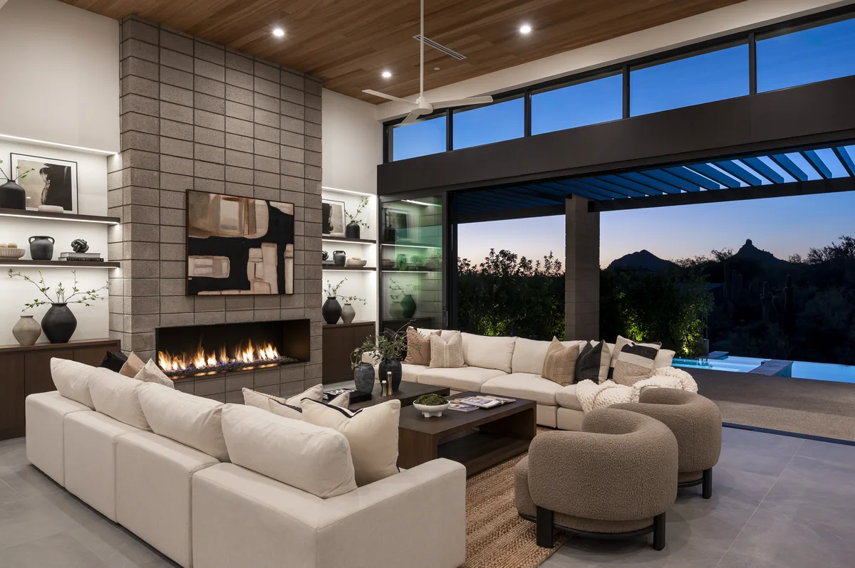 Glenn Moor great room with fireplace and wall of glass