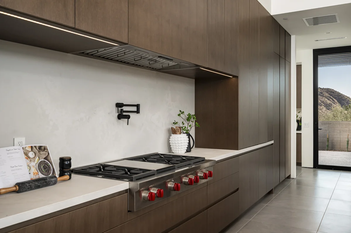 Glenn Moor kitchen with professional range and plaster hood