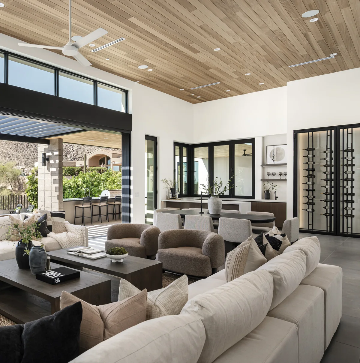 Glenn Moor living room and glass enclosed wine wall