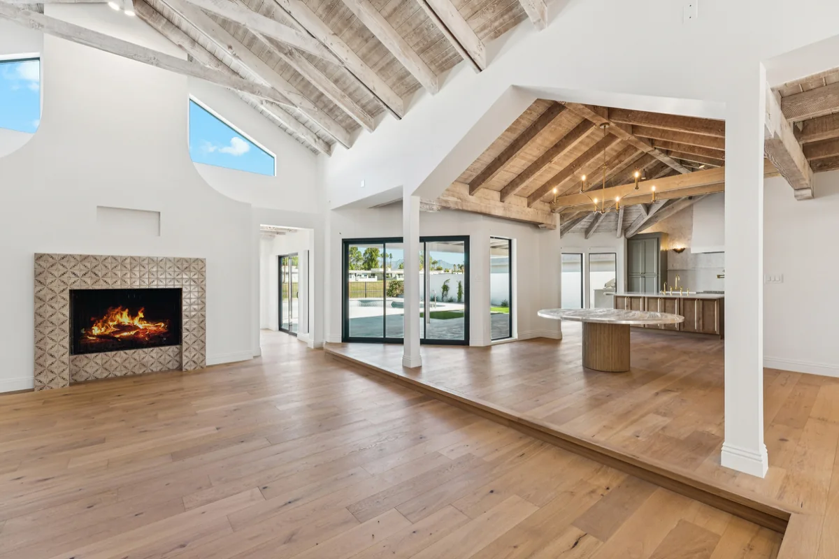 Open great room with exposed wood ceiling at Del Cadena